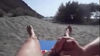 Wife gives me handjob on the beach